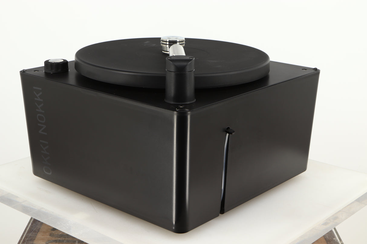 Front right corner of a used Okki Nokki One Record Cleaning Machine in a black finish