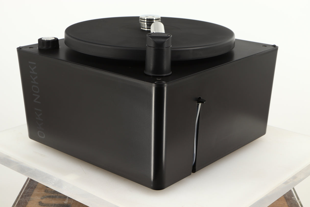 Front right corner of a used Okki Nokki One Record Cleaning Machine in a black finish