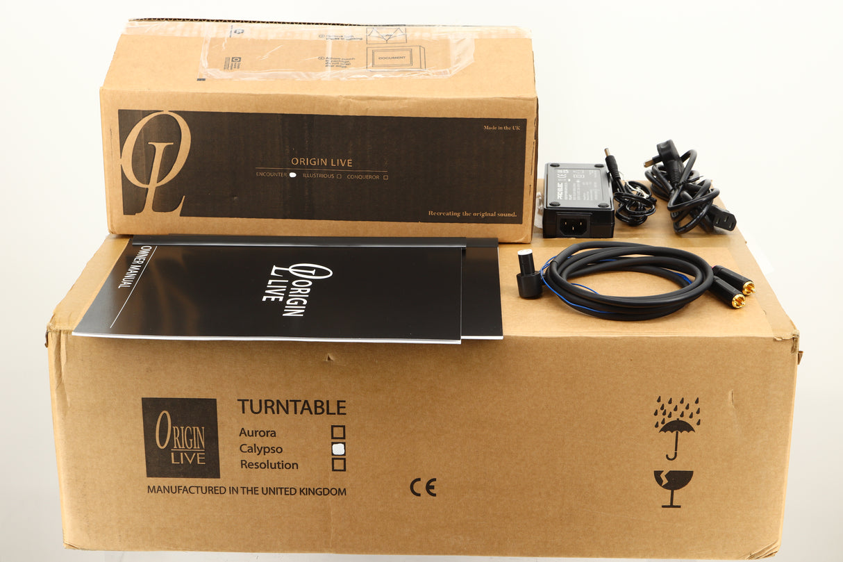 Boxes of a used Origin Live Calypso Mk5 Turntable with Encounter MK5 Tonearm showing manual, mains cable, and tonearm cable