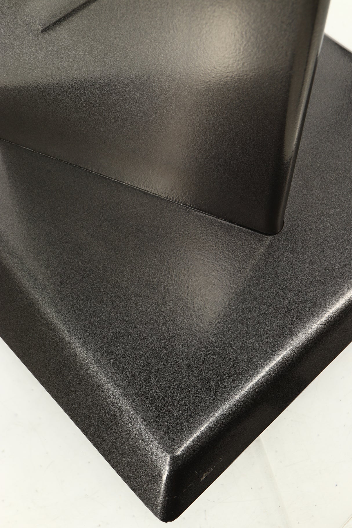 Close up of a used Partington Dreadnought Ultima 60cm Speaker Stand in a black mirror finish showing scratching on front bottom edge