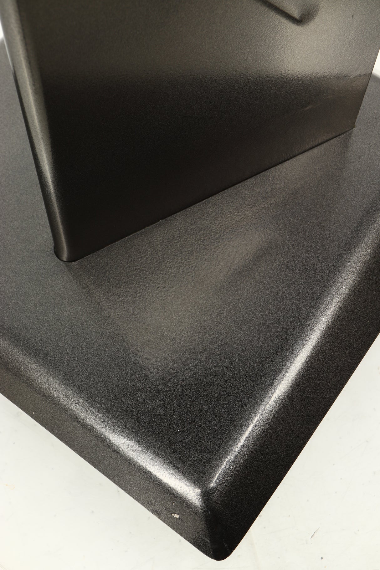 Close up of a used Partington Dreadnought Ultima 60cm Speaker Stand in a black mirror finish showing scratching on front bottom edge