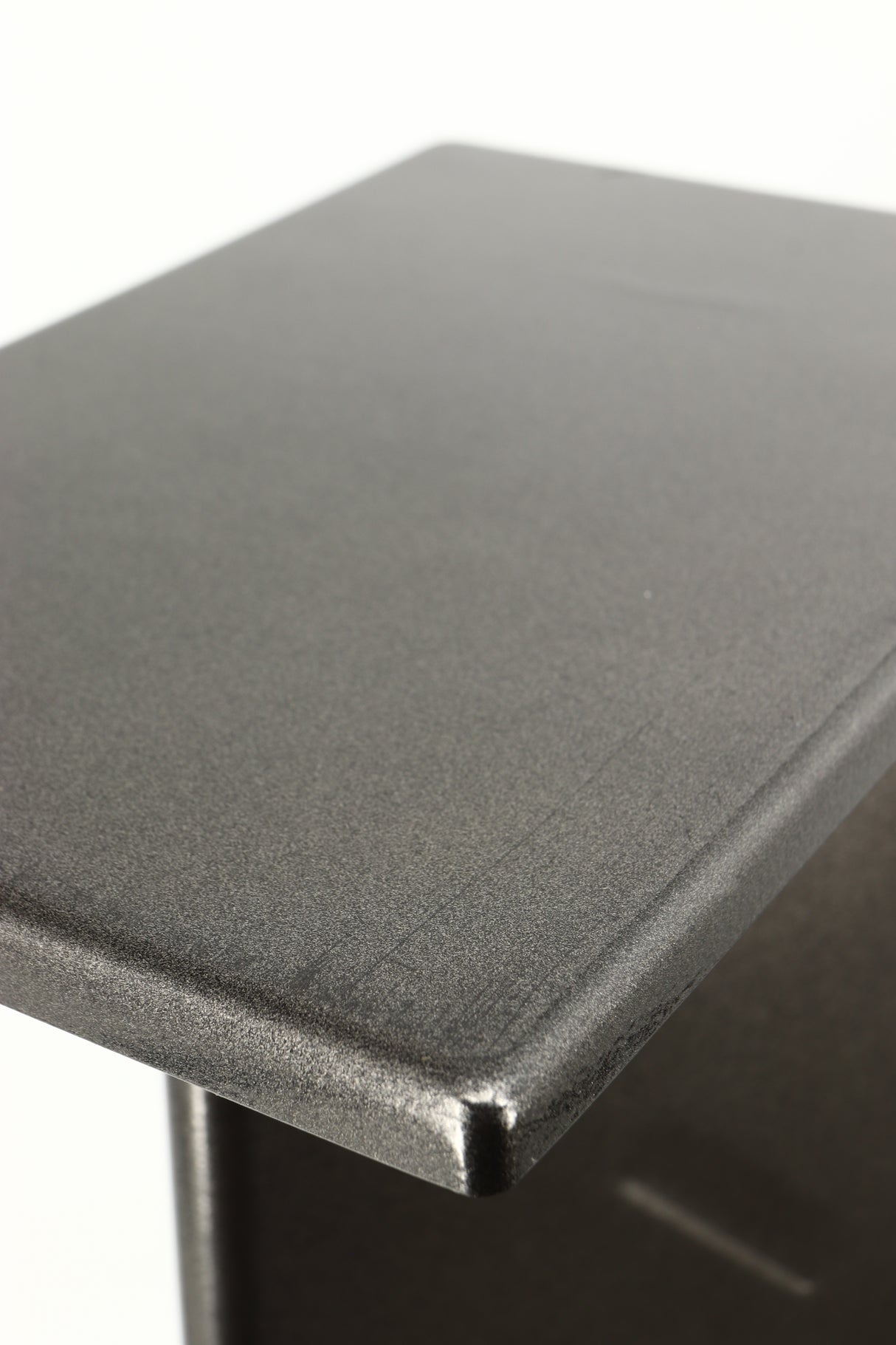 Close up of a used Partington Dreadnought Ultima 60cm Speaker Stand in a black mirror finish showing scratching on top