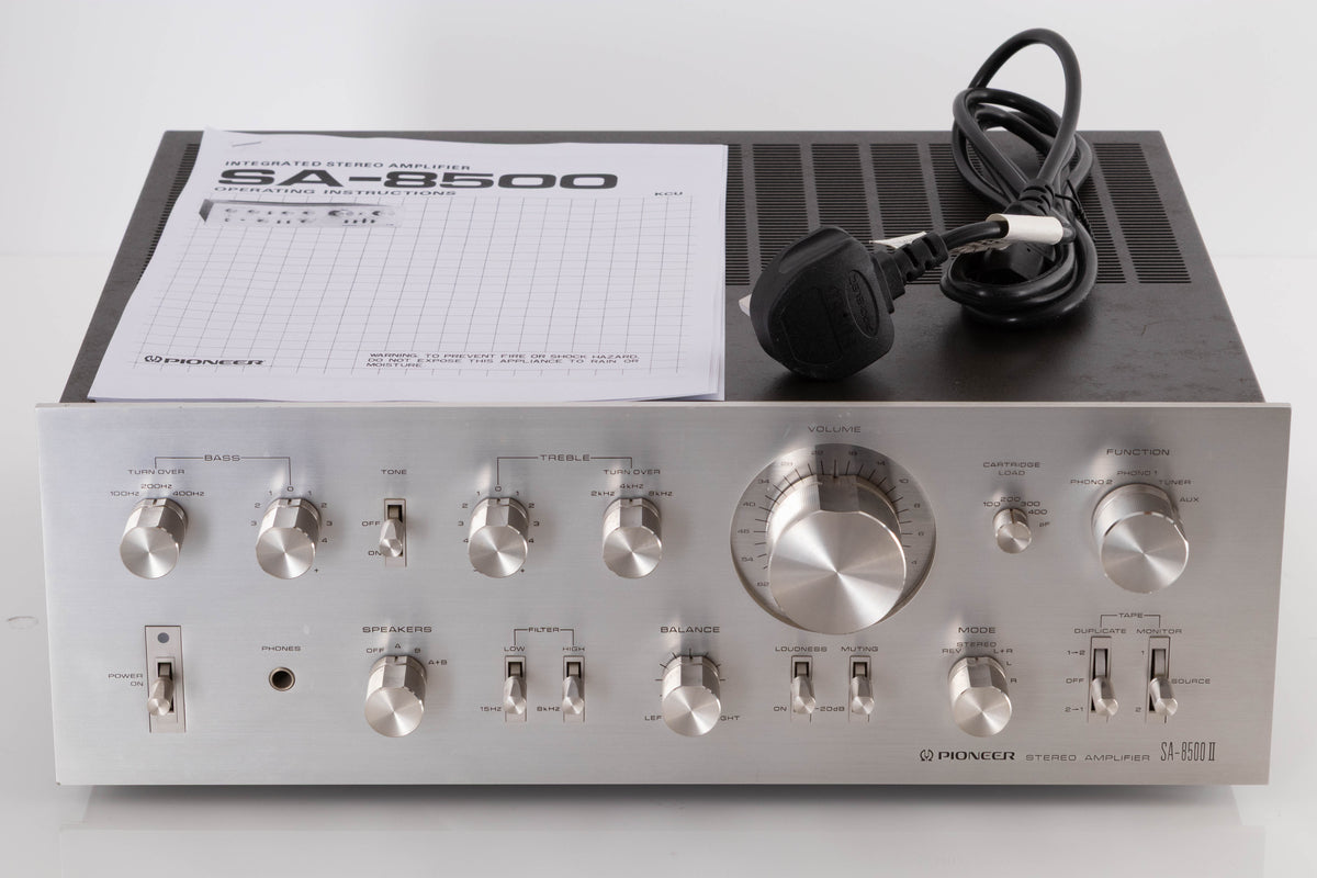 Front view of a used Pioneer SA-8500 II Integrated Amplifier with mains cable, and manual