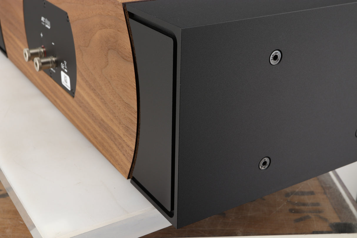 Rear left corner of a used PMC ProphecyC Centre Speaker in a walnut finish