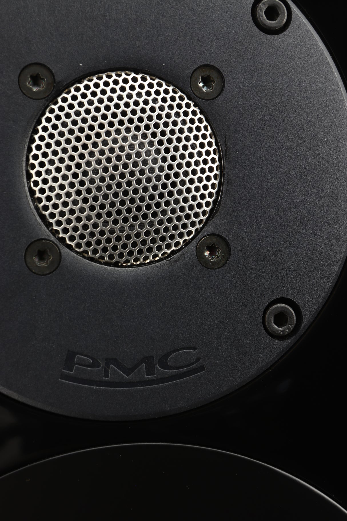 Close up view of a used PMC Twenty5 26i Floorstanding Speaker in Diamond Black finish showing some slight marks around the tweeter