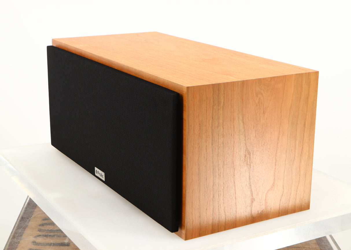 Front right corner of a used ProAc Centre Voice Speaker in a cherry finish