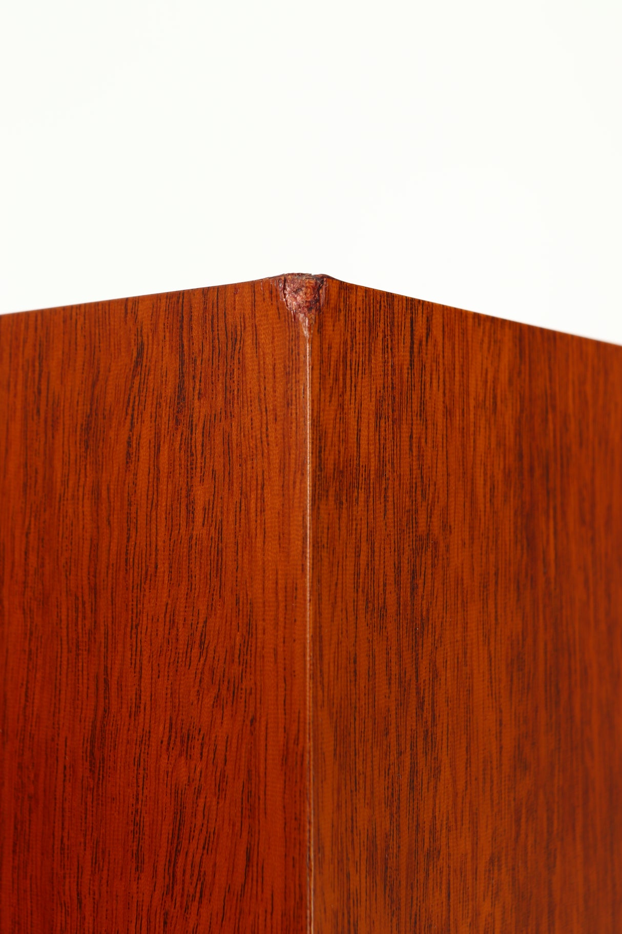 Close up of a used Proac Response D18 Floorstanding Speaker in a mahogany finish showing blemish on rear left corner