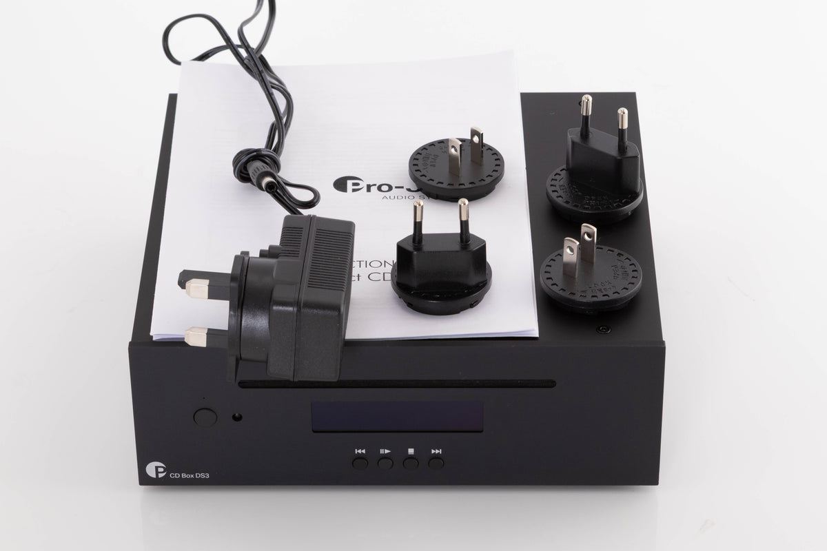 Top of a used Project CD Box DS3 CD Player in a Black finish showing PSU, Manual and Schuko Plugs