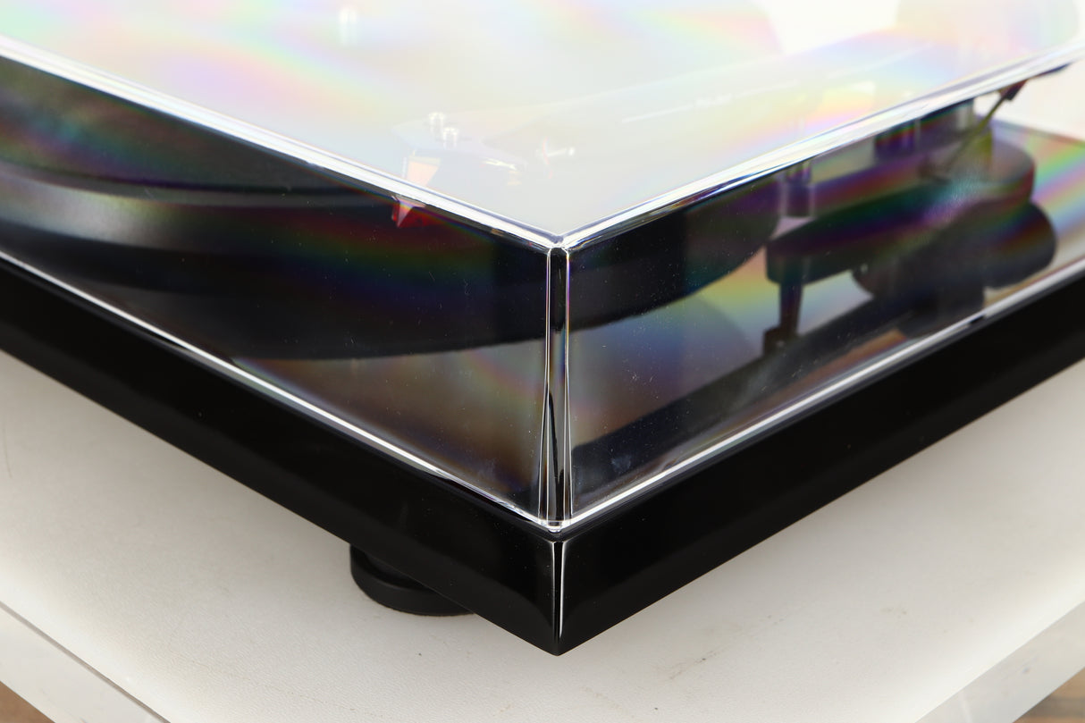 Front right corner of a used Project Debut Carbon Evo DC Turntable in a black finish