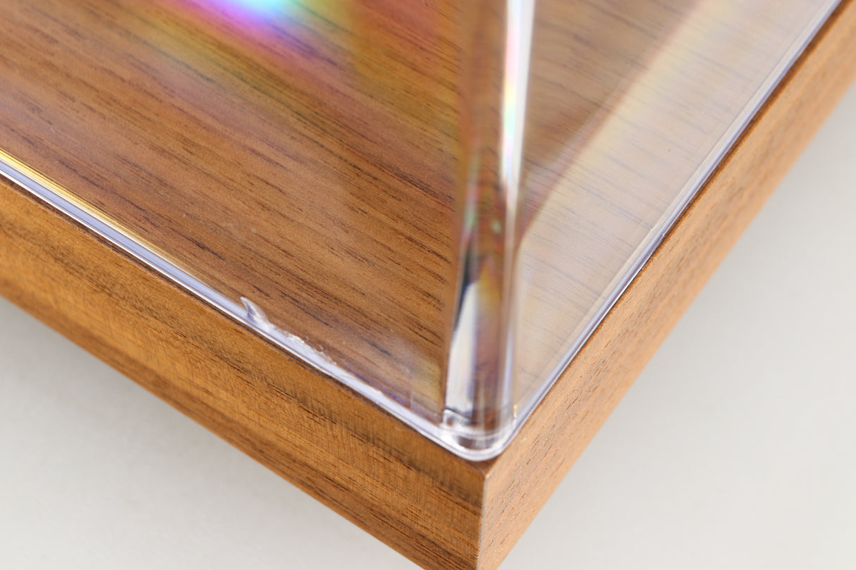 Close up of a used Project Debut Carbon Evo Turntable / Ortofon 2M Bronze Cartridge in a walnut finish showing a small crack on lid