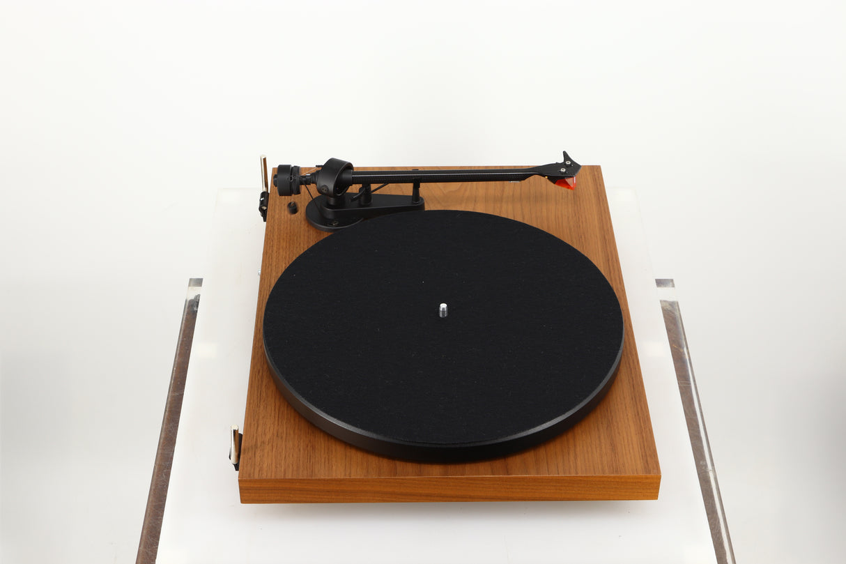 Left side view of a used Project Debut Carbon Evo Turntable / Ortofon 2M Bronze Cartridge in a walnut finish