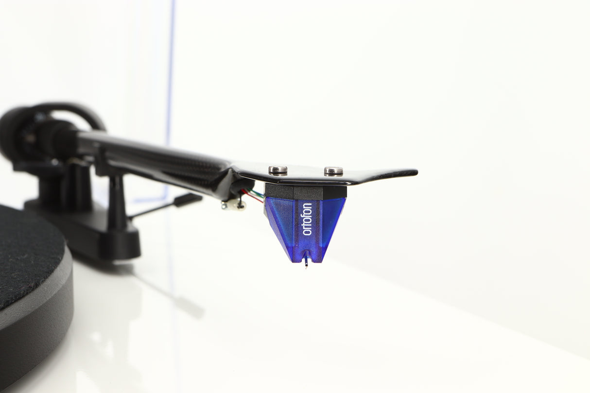 Close up of a used Project Debut Carbon Turntable / Ortofon 2M Blue Cartridge in a white finish showing stylus