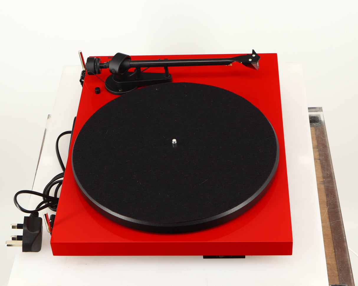 Left side view of a used Project Debut Carbon Turntable in a red finish