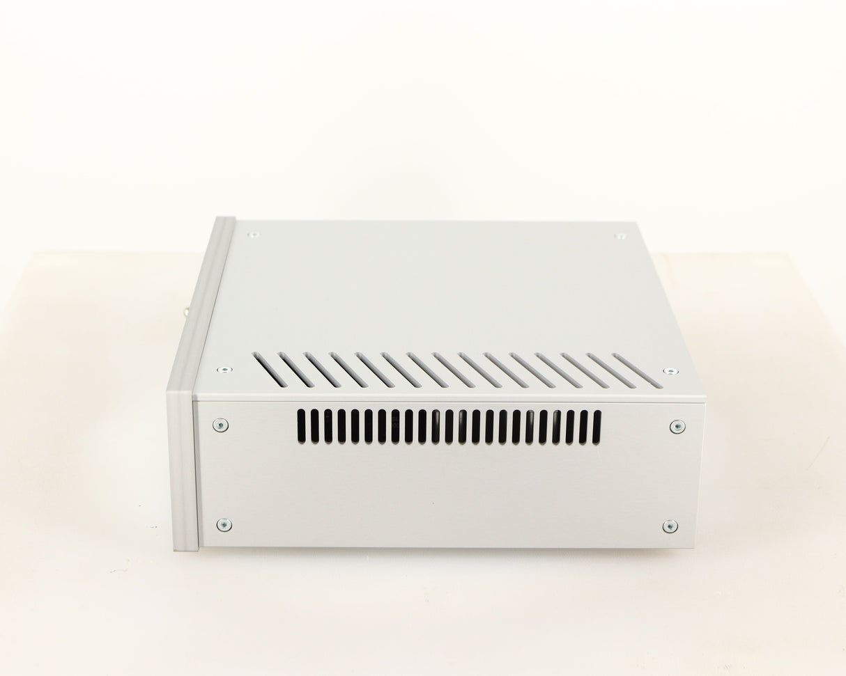 Right side view of a used Project Power Box RS Uni-1-Way Power Supply in a silver finish