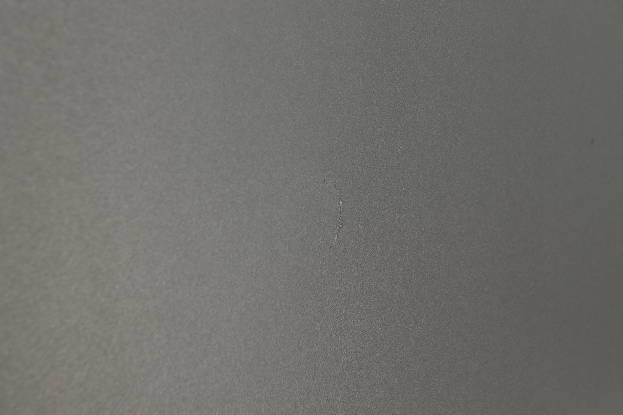 Close up of a used Q Acoustics 2070si Subwoofer in a black finish showing mark on left side