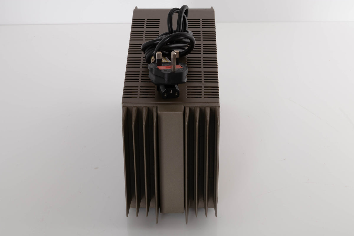 Top of a used Quad 303 Power Amplifier showing Mains Cable