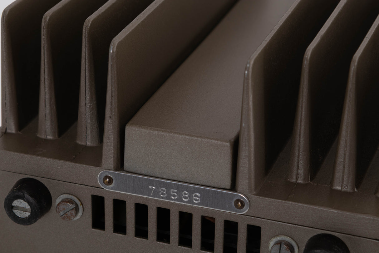 Close up of a used Quad 303 Power Amplifier showing serial number