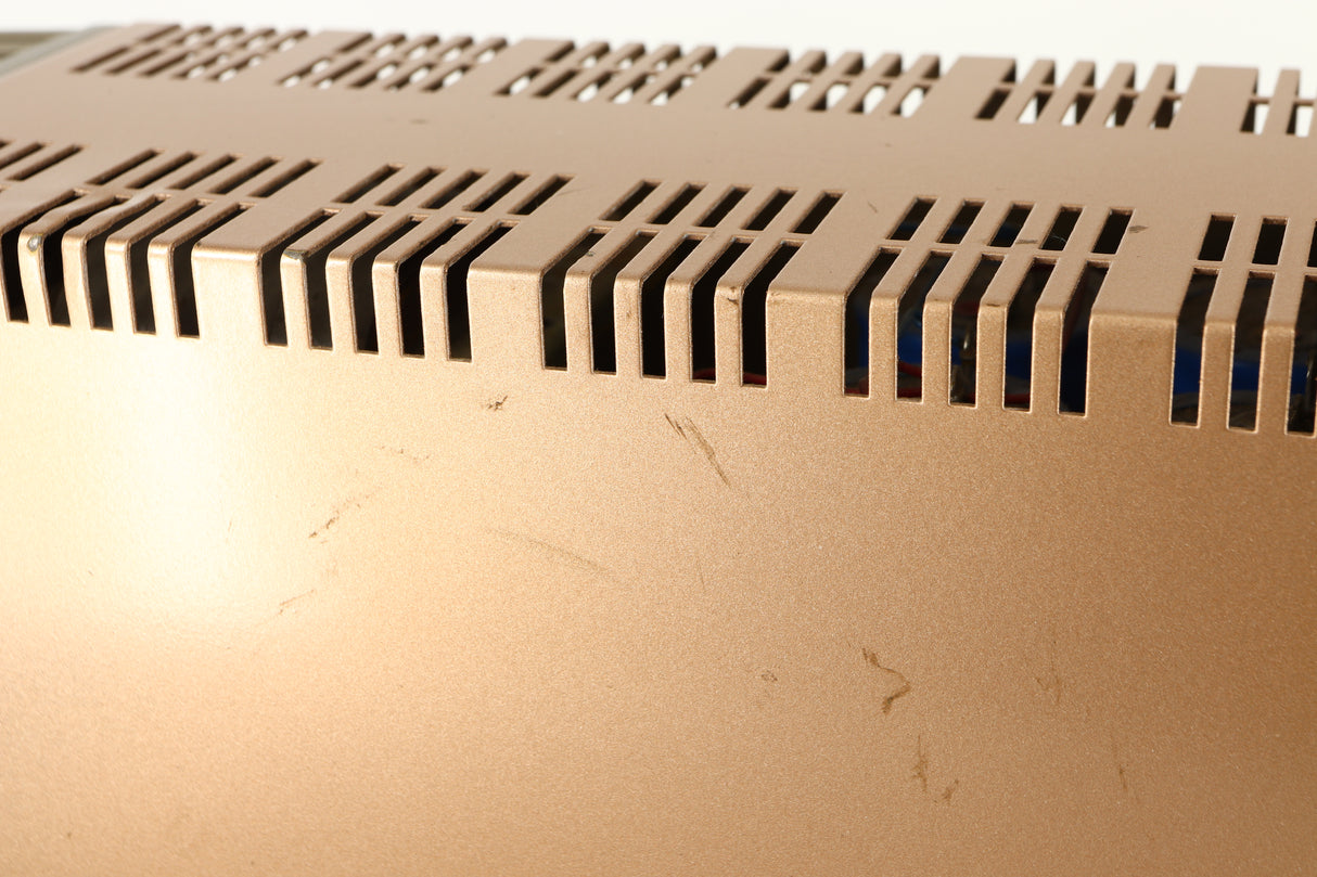 Close up of a used Quad 303 Power Amplifier showing some marks on right side