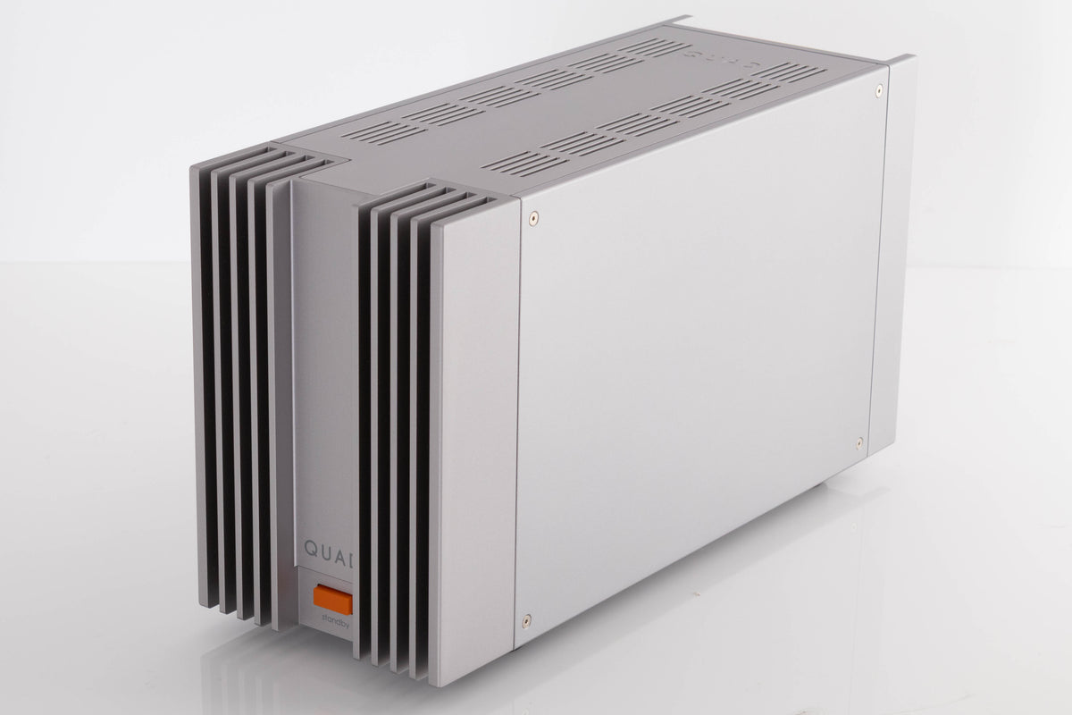 Front right corner of a used Quad 303 Power Amplifier in a Silver finish