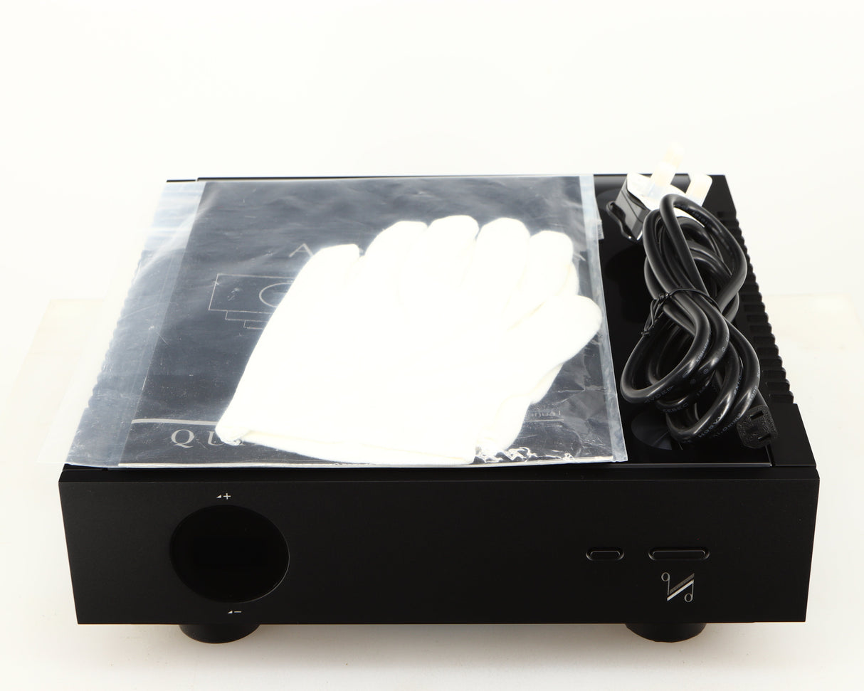 Top of a used Quad Artera Pre Amplifier in a black finish showing Mains Cable, 2x Gloves and Manual
