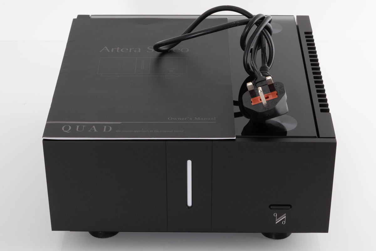 Top of a used Quad Artera Stereo Power Amplifier in a Black finish showing Mains Cable and Manual