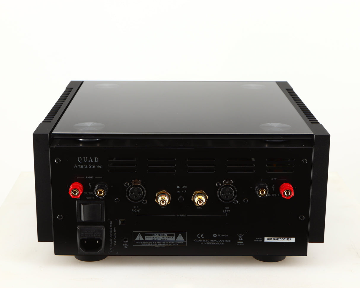 Rear view of a used Quad Artera Stereo Power Amplifier in a black finish showing Speaker Ouputs, Mains Input, Line Inputs and XLR Inputs
