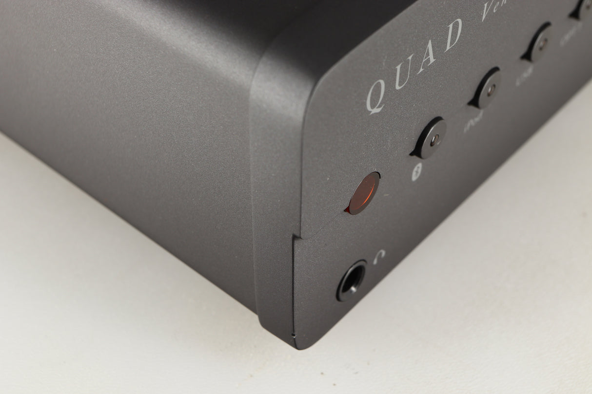 Close up of a used Quad Vena Integrated Amplifier in a lancaster grey finish showing small chip on front right corner