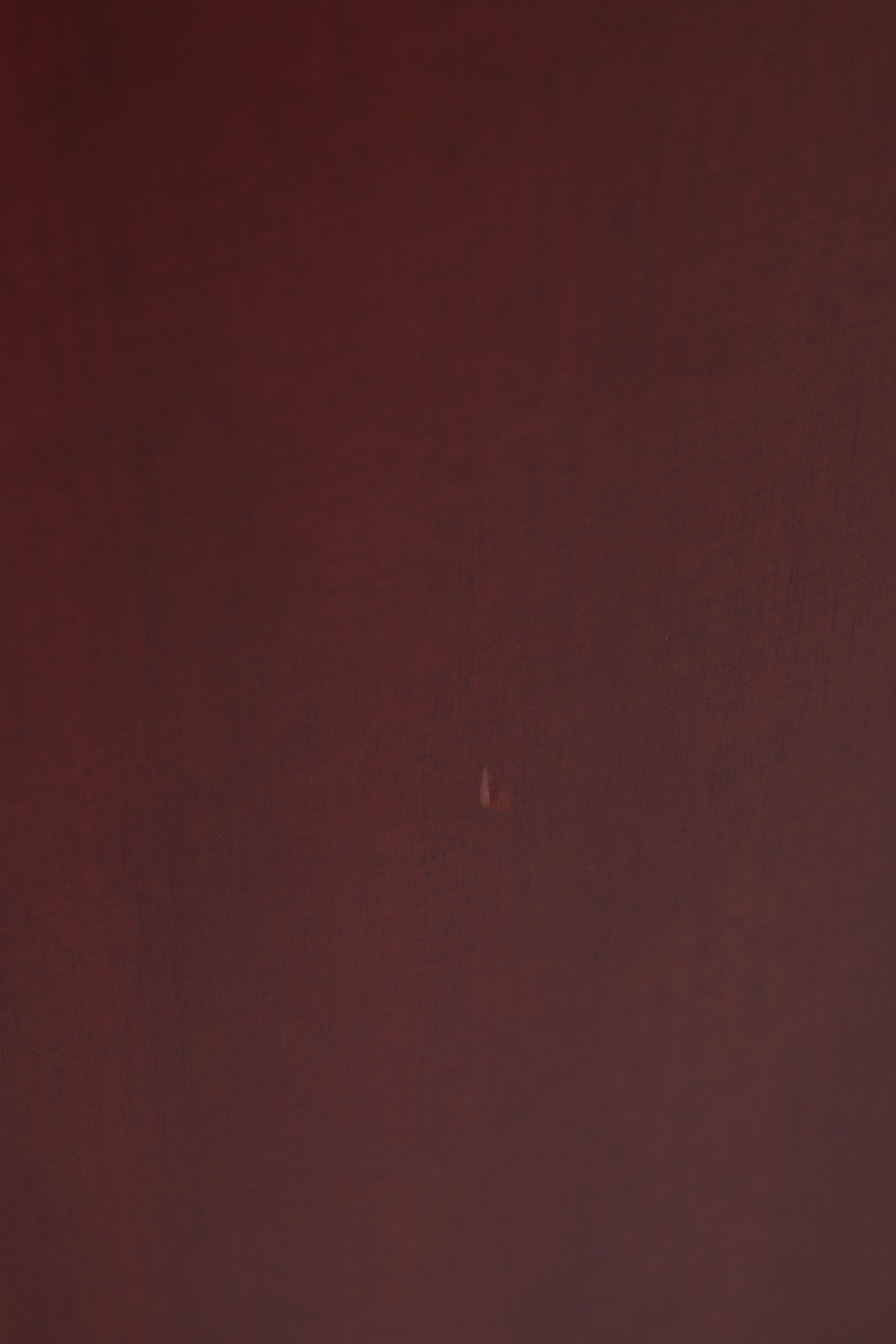 Close up of a used Quad S-4 Floorstanding Speaker in a Sapele Mahogany finish showing small dink in cabinet