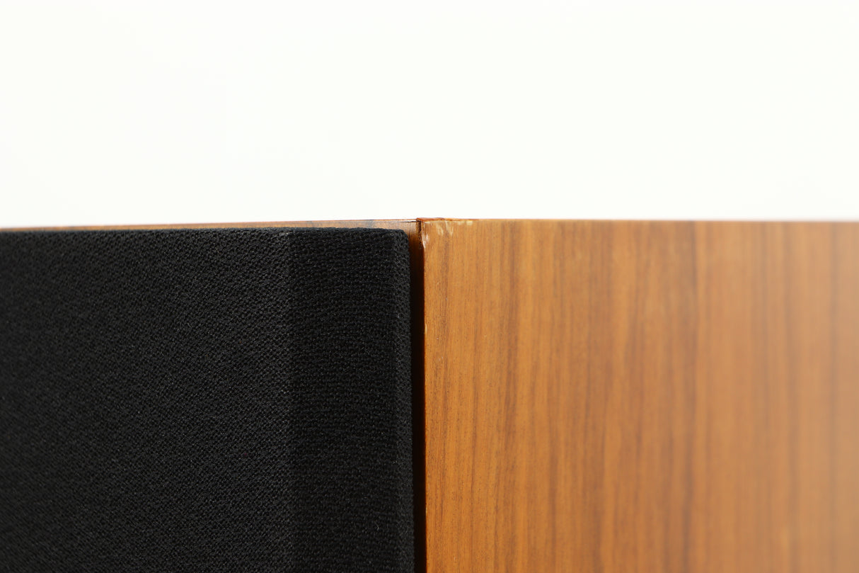Close up of a used Red Rose Music Spirit Ribbon Standmount Speaker in a rosewood finish showing blemish on front right corner