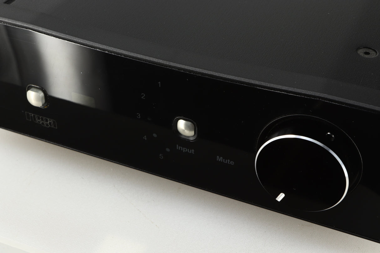 Close up of a used Rega Brio-R Integrated Amplifier in a black finish showing light scratching on screen