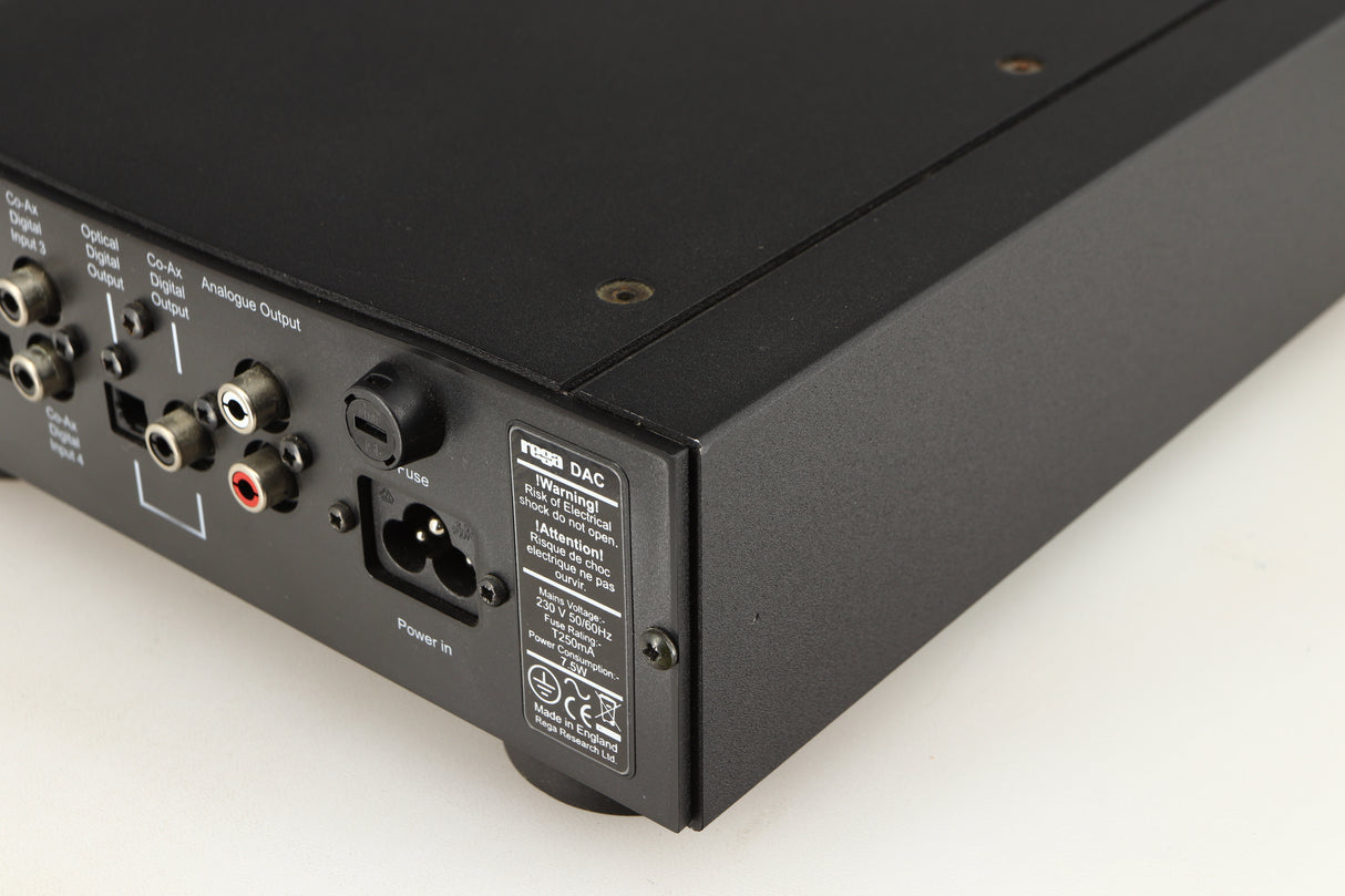 Rear left corner of a used Rega DAC Digital Analogue Converter in a black finish