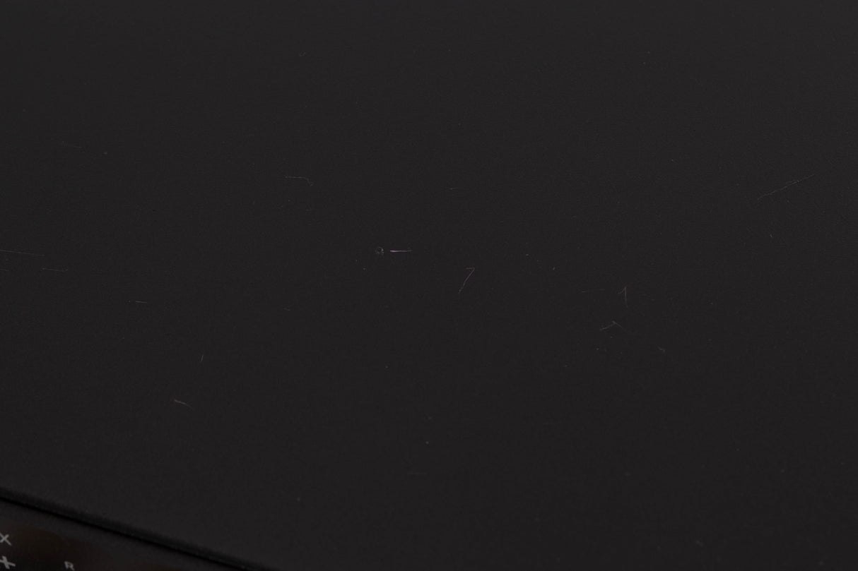Close up of a used Rega Elex MK4 Integrated Amplifier in a Black finish showing scratches on top