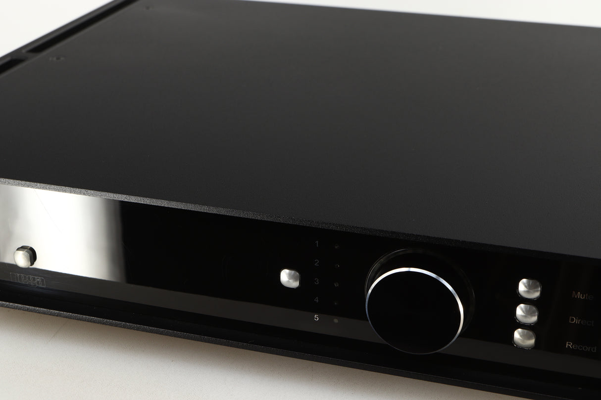 Close up of a used Rega Elicit-R Integrated Amplifier in a black finish showing some scratching on screen