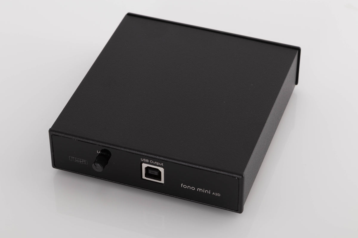 Close up of a used Rega FONO MINI A2D Phonostage in a Black finish showing some scratching on screen