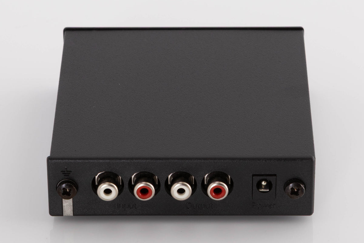 Rear view of a used Rega FONO MINI A2D Phonostage in a Black finish showing Power Input, Phono Inputs and Phono Outputs