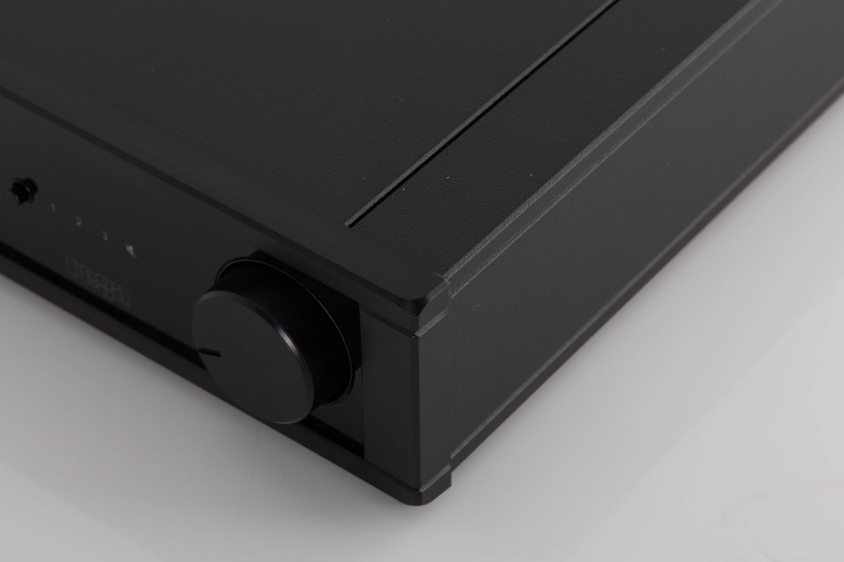Front right corner of a used Rega IO Integrated Amplifier in a Black finish
