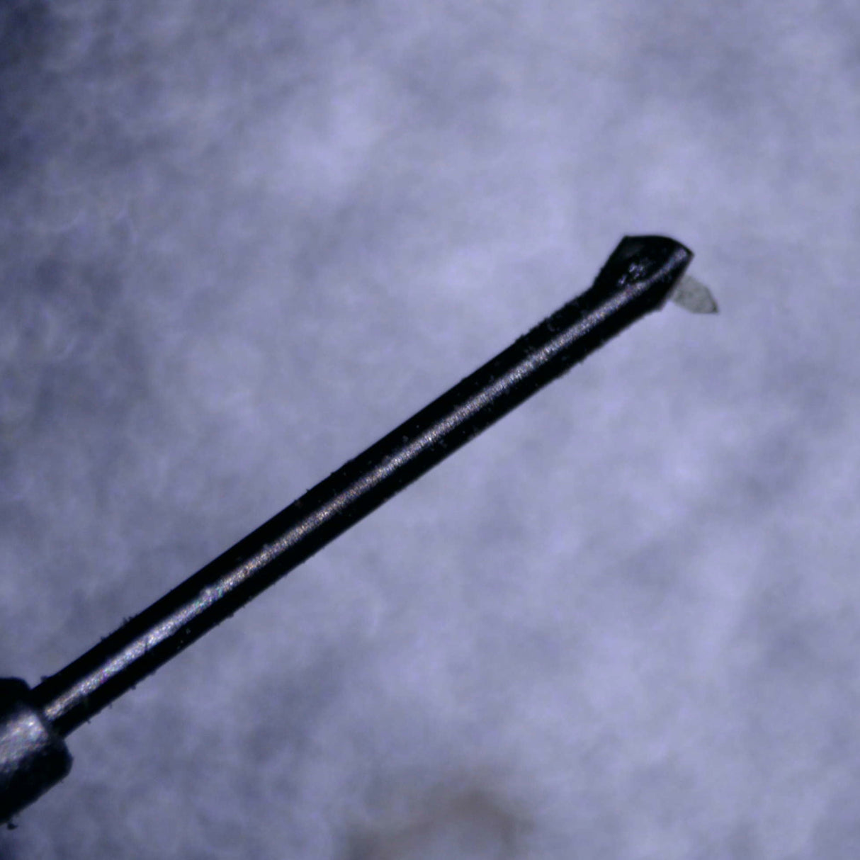 Close up of a used Rega ND9 Moving Magnet Cartridge in a silver finish showing the stylus