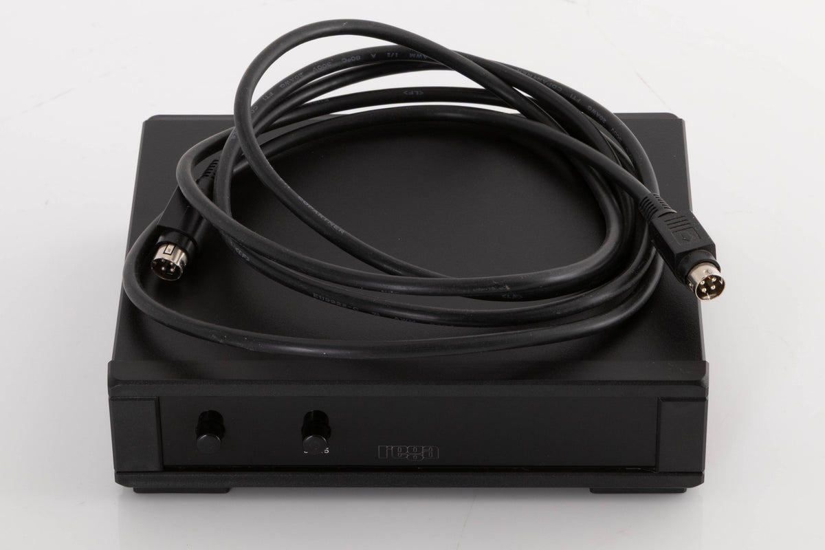 Top of a used Rega NEO Turntable Power Supply in a Black finish showing DIN Cable