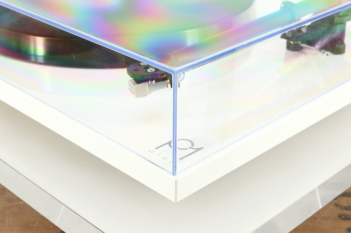 Front right corner of a used Rega Planar 1 Plus Turntable in a white finish