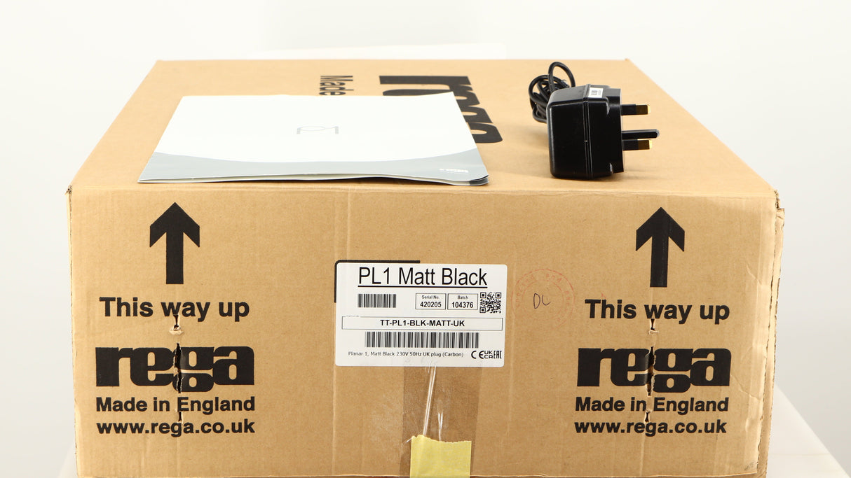 Box for a used Rega Planar 1 Turntable in a matt black finish showing Manual and PSU
