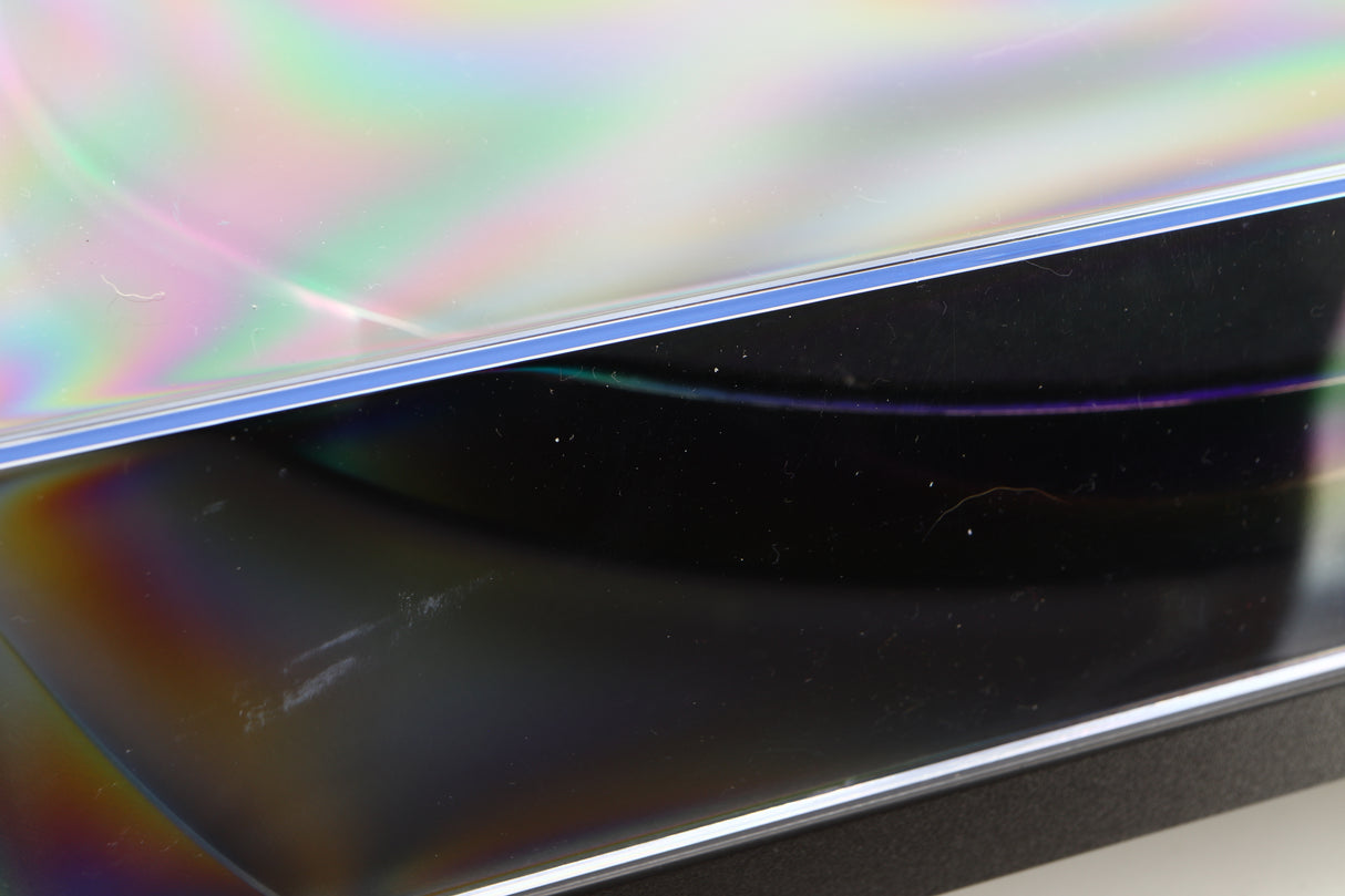 Close up of a used Rega Planar 1 Turntable in a matt black finish showing scratch on lid