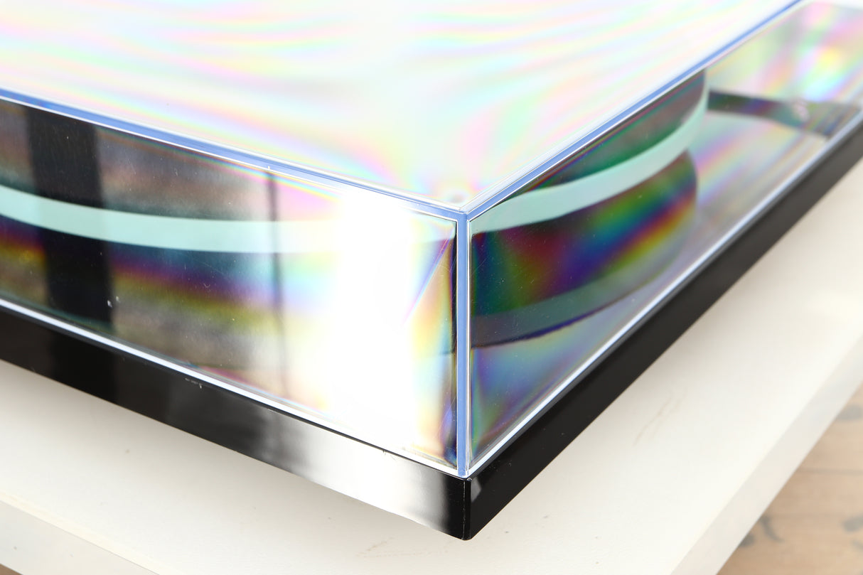 Front left corner of a used Rega Planar 2 / Elys 2 Cartridge in a black gloss finish