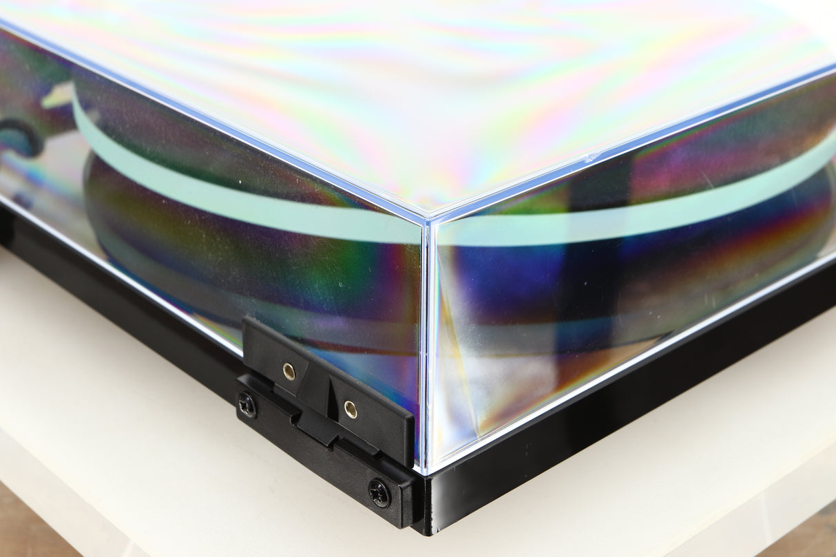 Rear left corner of a used Rega Planar 2 / Elys 2 Cartridge in a black gloss finish