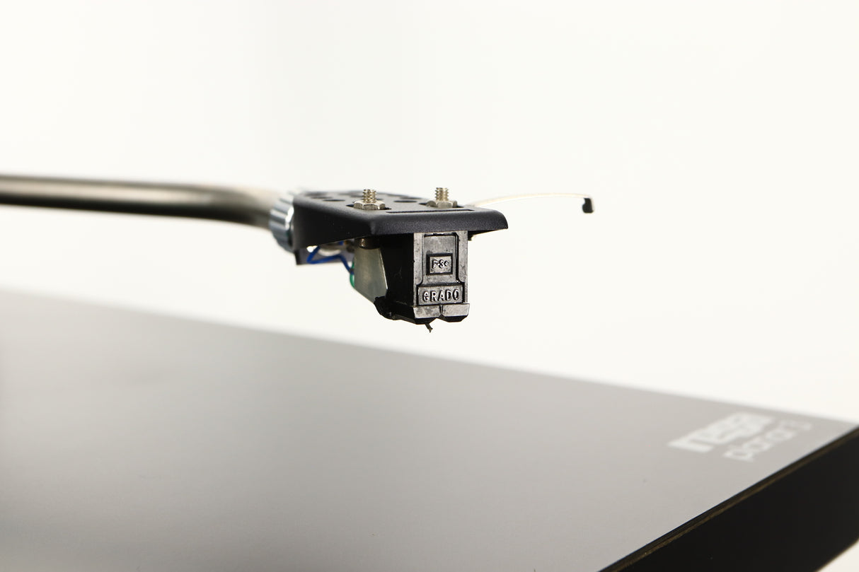 Close up of a used Rega Planar 3 (24V Motor Upgraded) Turntable / Grado F3+ Cartridge in a black finish showing stylus