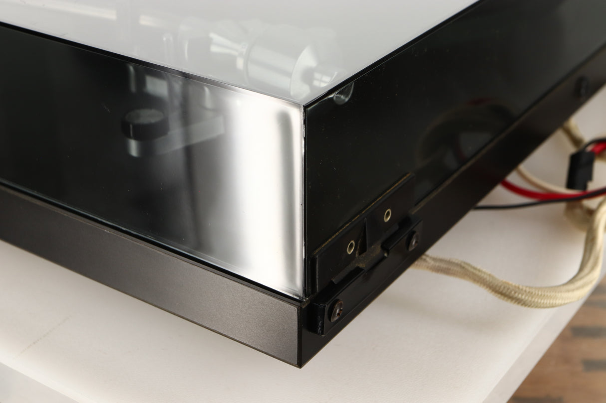 Rear right corner of a used Rega Planar 3 (24V Motor Upgraded) Turntable / Grado F3+ Cartridge in a black finish