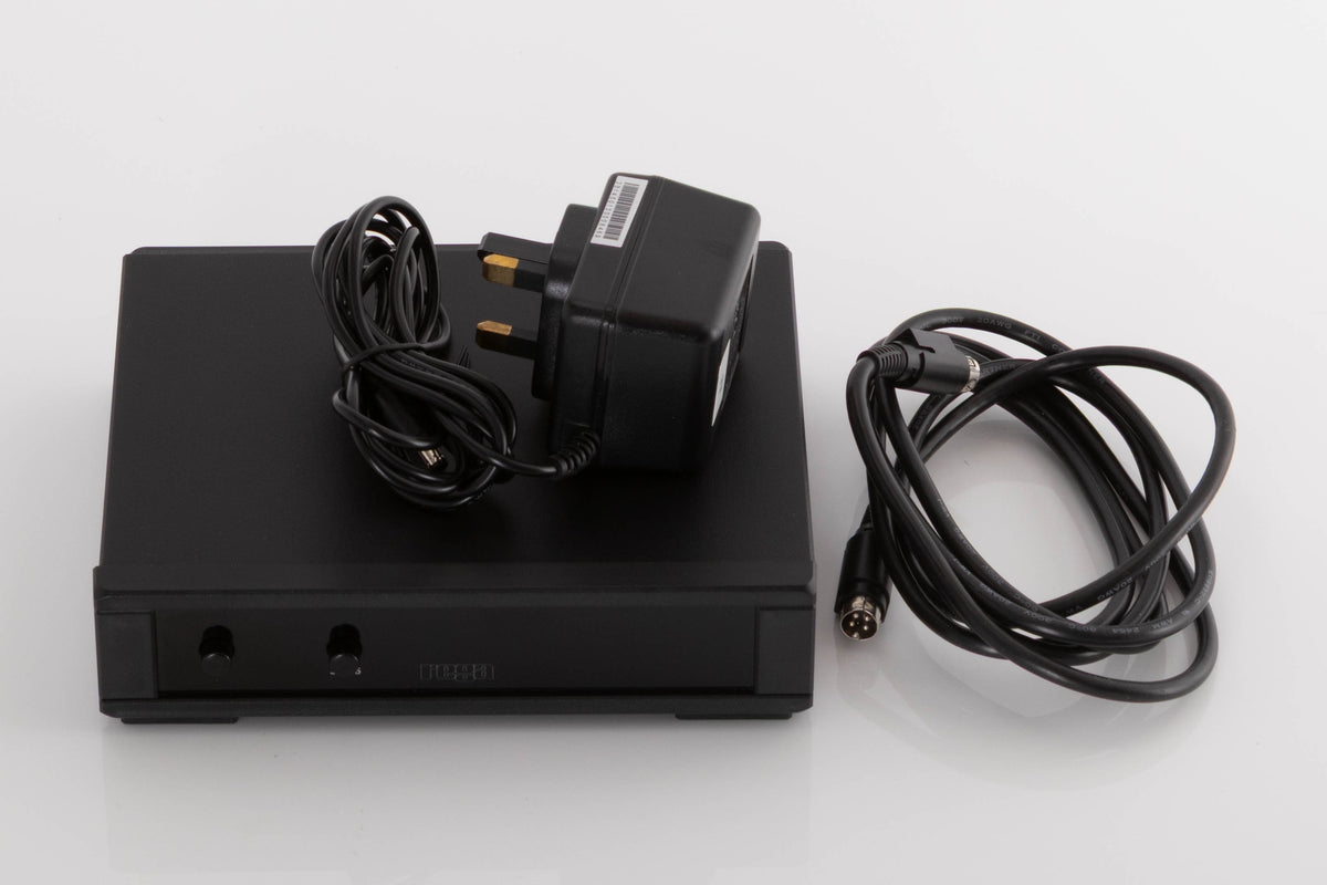 Accessories for a used Rega Planar 3 50th Anniversary Turntable in a Walnut finish showing NEO PSU MK2, PSU and DIN Cable