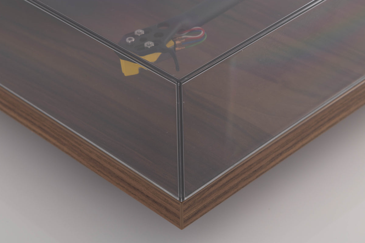 Front right corner of a used Rega Planar 3 50th Anniversary Turntable in a Walnut finish