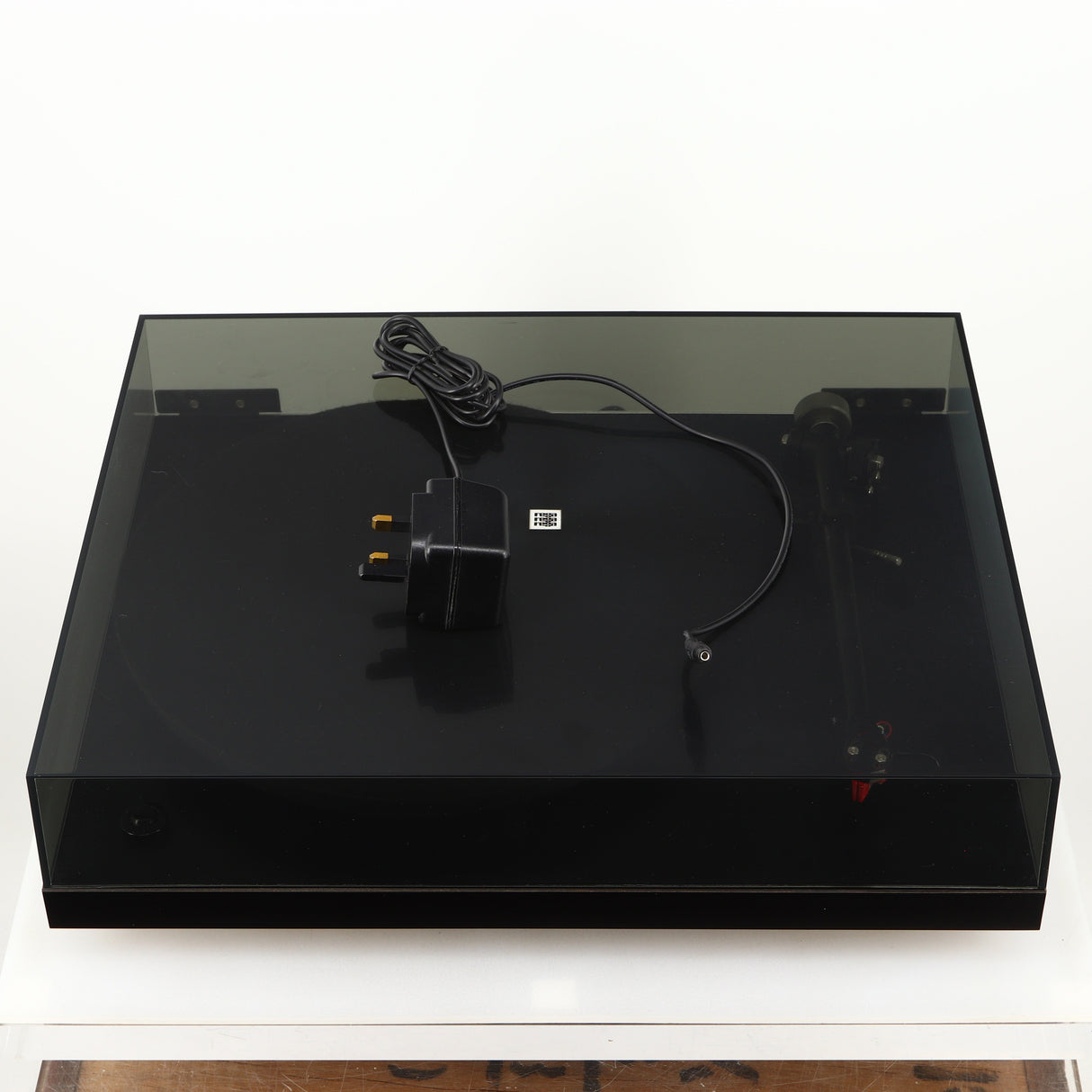 Top of a used Rega Planar 3 Turntable 24V Upgraded in a black finish showing Power Supply