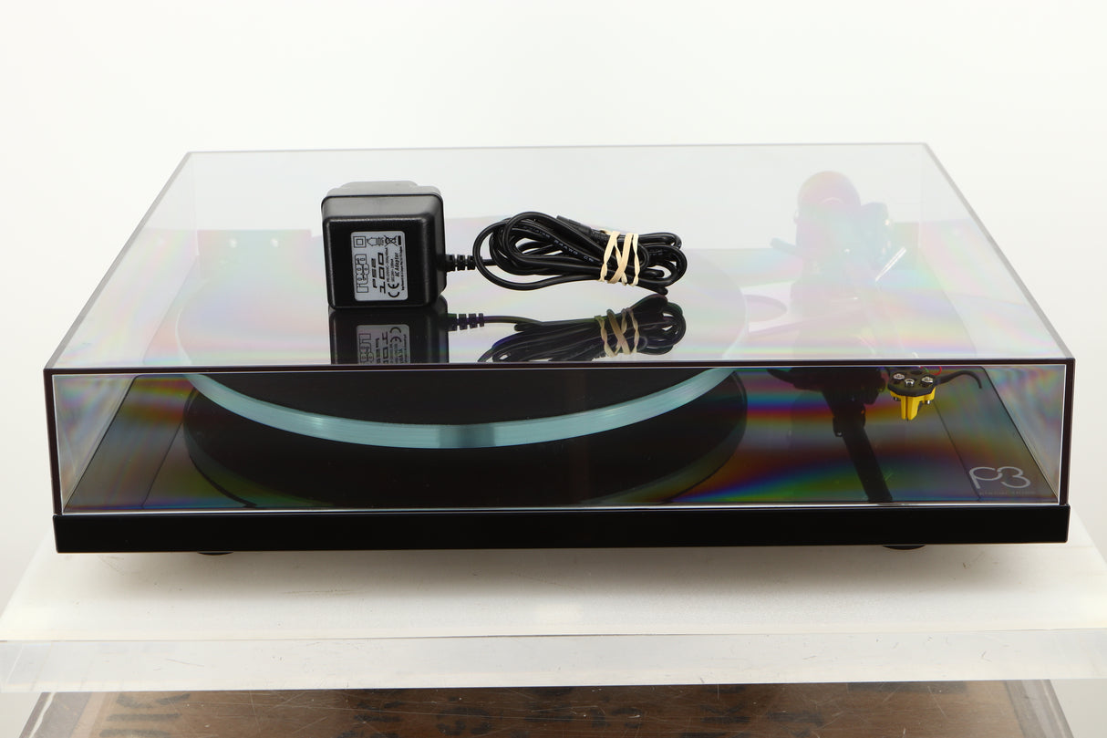View of a used Rega Planar 3 Turntable in Gloss Black finish with Exact Cartridge showing mains cable