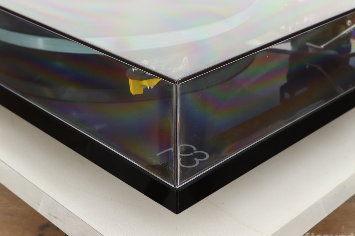 Front right corner view of a used Rega Planar 3 Turntable in Gloss Black finish with Exact Cartridge